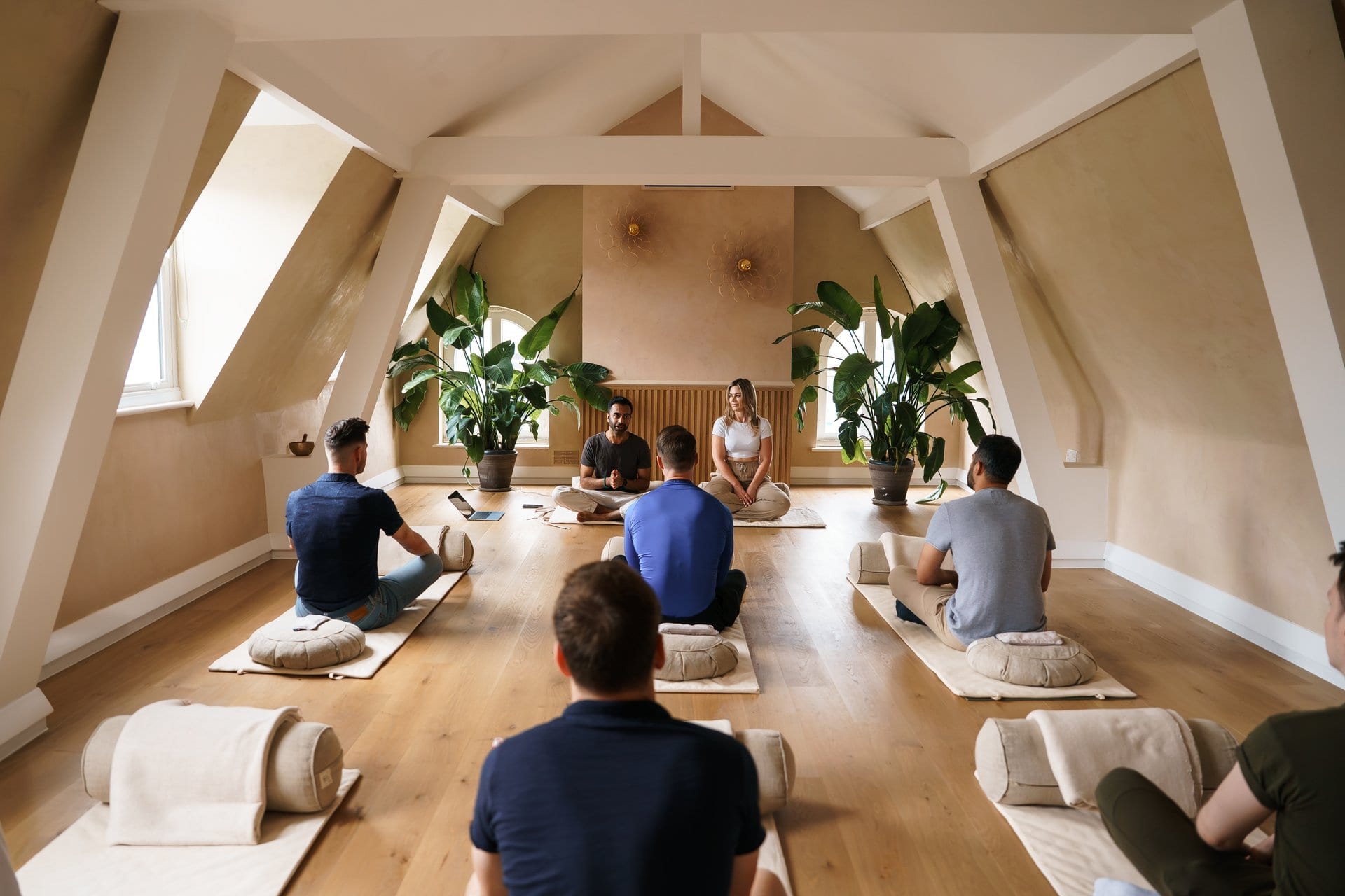 Group breathwork workshop in a bright attic studio with Ryan Samtani facilitating