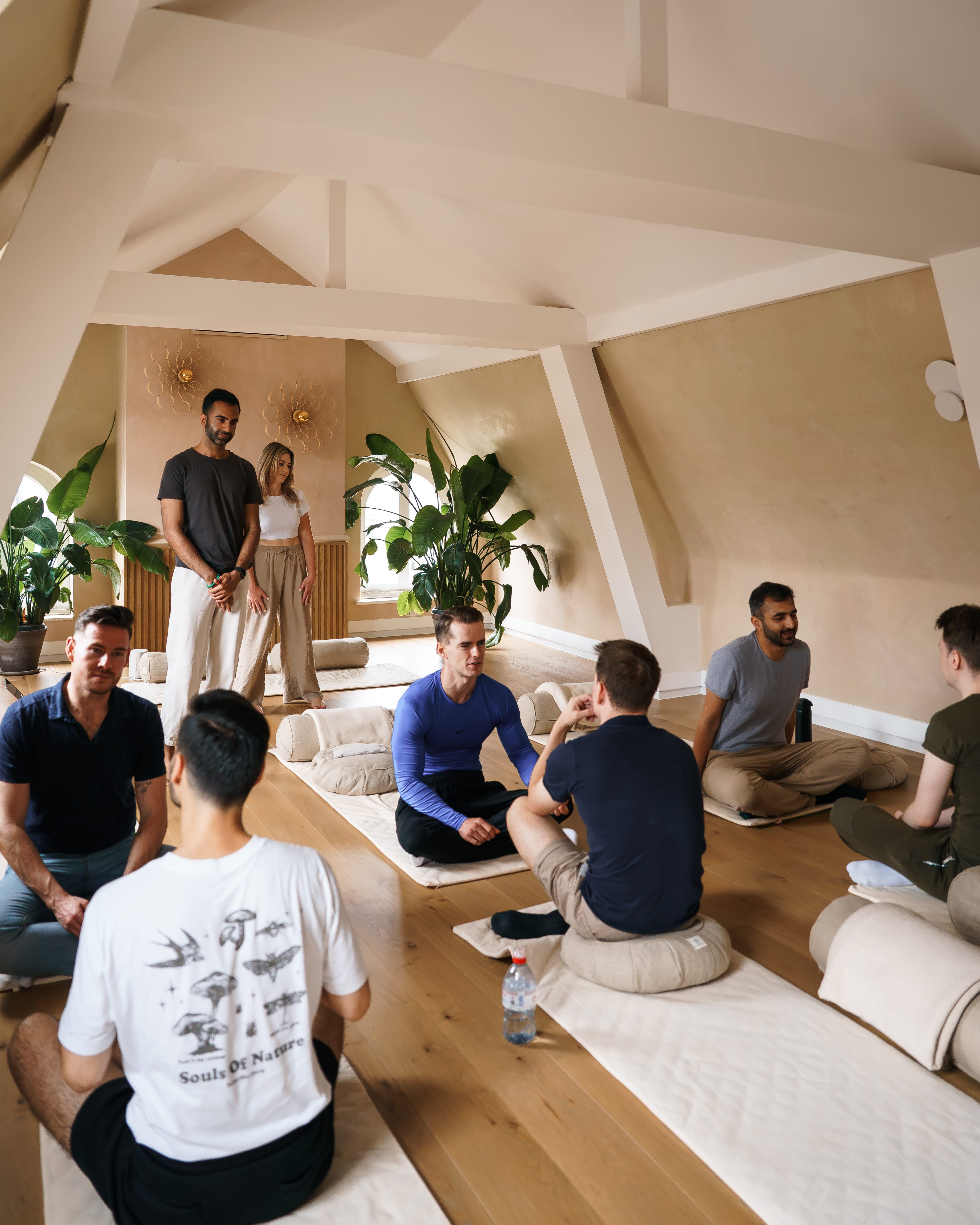 Group breathwork session in a bright studio